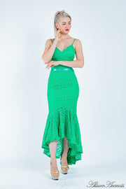 Woman wearing a green high-low floral lace dress.