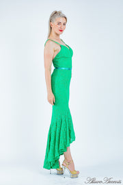 Woman wearing a green high-low floral lace dress.