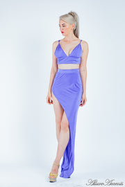 Woman wearing an azure 2 pieces set, summer crop top and sexy side slit long skirt