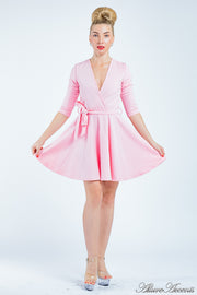Women is wearing a light pink mini swing dress, casual mid-sleeves all season appropriate dress