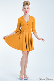 Women is wearing a golden mini swing dress, casual mid-sleeves all season appropriate dress
