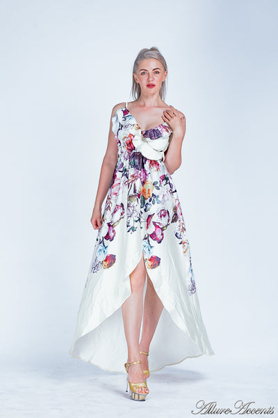 Women is wearing a white multi color floral maxi dress, sexy satin floral sundress with low-cut back with ruffles detail 