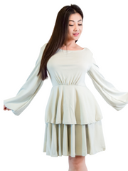 Woman is wearing a grey mini layers dress, casual long sleeves dress appropriate for all seasons 