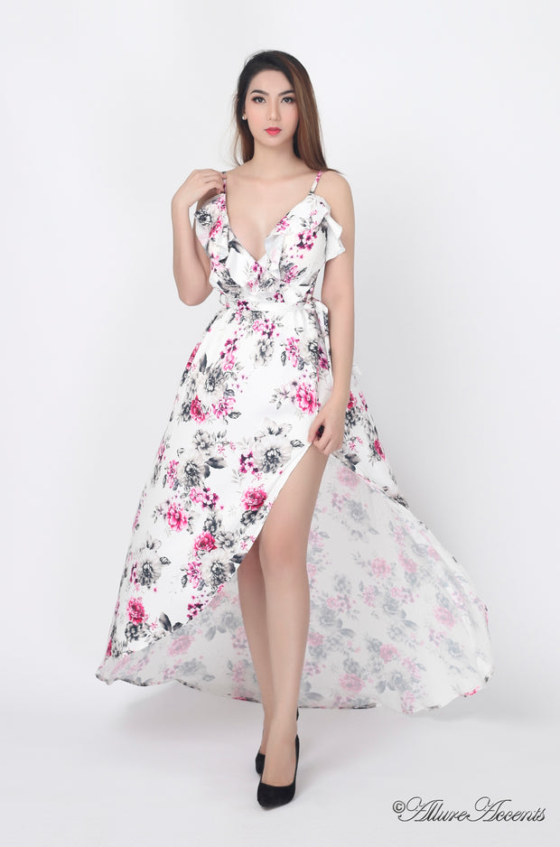 Women is wearing a white multi color floral maxi dress, sexy satin floral sundress with low-cut back with ruffles detail 