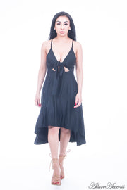 Woman is wearing a black hi-low dress, sexy summer sleeveless casual dress with front adjustable tie bow