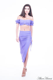 Woman is wearing an azure 2 pieces summer party set, ruffle top and ruche tie skirt 