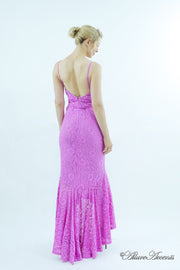 Woman showing a lavender high-low floral lace dress has a low back opening.