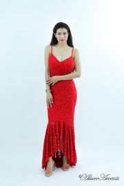 Woman wearing a red high-low floral lace dress.