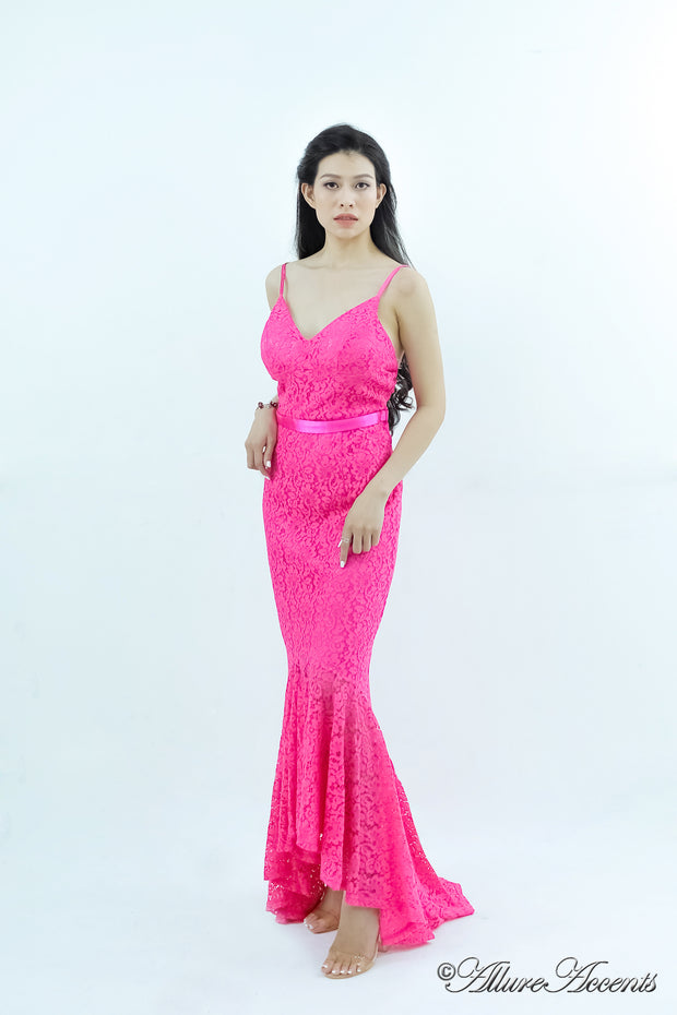 Woman wearing a barbie pink high-low floral lace dress.