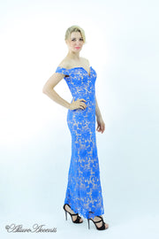 Woman wearing an off-the-shoulder blue lace dress.