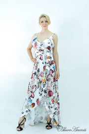Women is wearing a white multi color floral maxi dress, sexy satin floral sundress with low-cut back with ruffles detail 