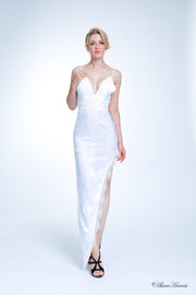 woman wearing a sexy long high slit white satin dress with lace details 