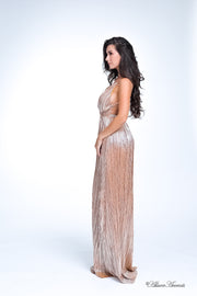 Woman wearing a caramel brown colored maxi length slip dress with a deep v neck.