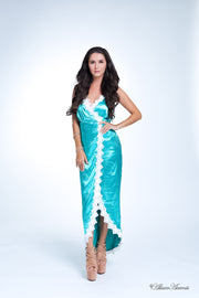 Woman wearing a sapphire satin midi dress, low-cut back with lace details