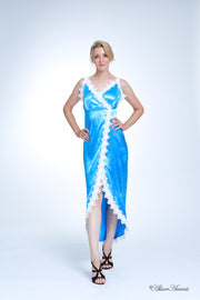 A woman wearing a sexy turquoise satin midi dress with lace details