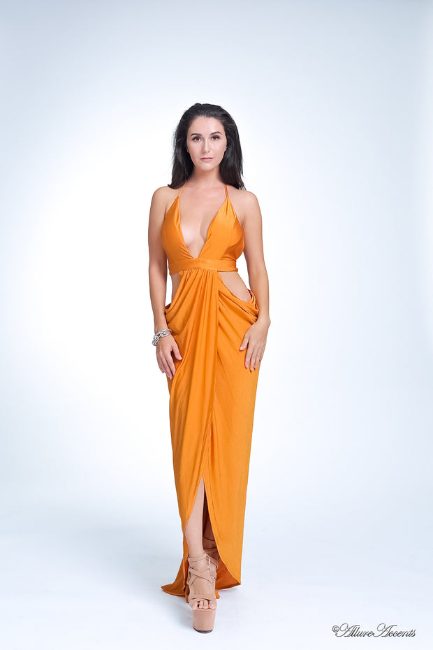 A woman wearing sexy gold party long maxi dress