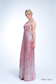 Woman wearing a cherry red colored maxi length slip dress with a deep v neck.